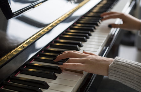 Woman hands playing piano