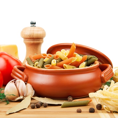 pasta and spices in a ceramic potの写真素材