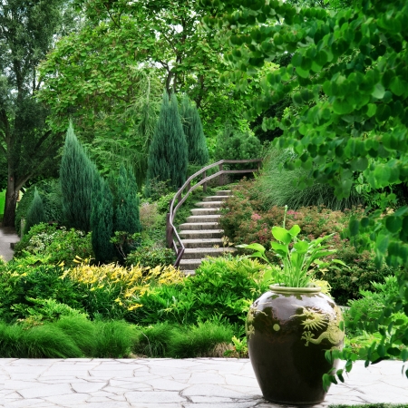 Park with beautiful avenues, flowerbeds and shrubsの写真素材