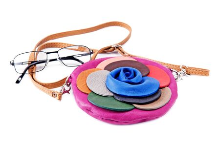 handbag and glasses isolated on white backgroundの写真素材