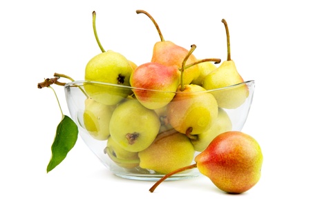 Ripe pears on a plate isolated on white backgroundの写真素材