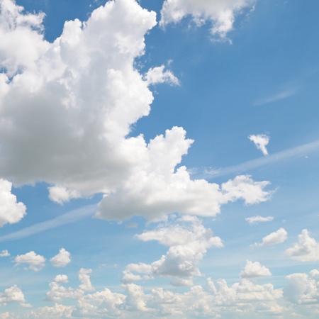    fluffy clouds in the blue sky                                 の写真素材
