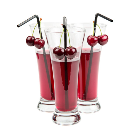 glasses of cherry juice isolated on white backgroundの写真素材