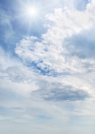    sun on blue sky with white clouds                                 の写真素材
