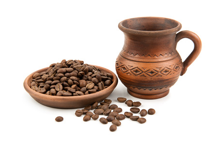 pottery and coffee beans isolated on white backgroundの写真素材