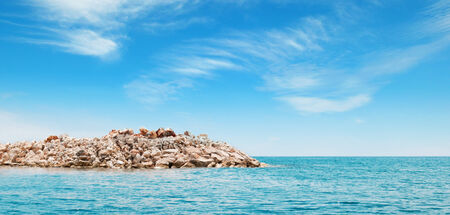 azure sea and the rocky islandの写真素材