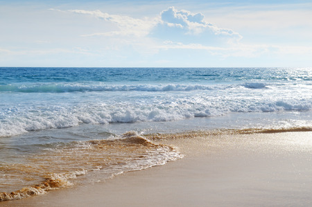 seascape, sand beach and blue skyの写真素材