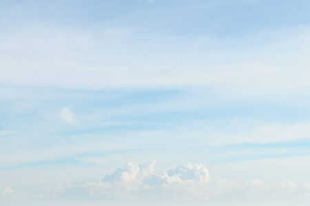 fluffy clouds in the blue skyの写真素材