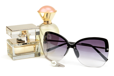 perfume bottles, sunglasses and chain isolated on white backgroundの写真素材