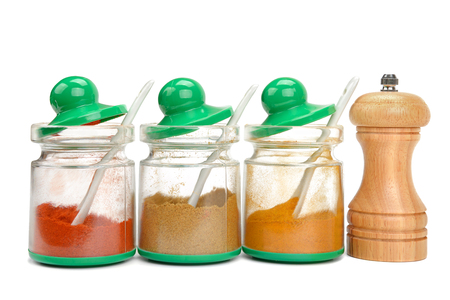 spices in jars and mill isolated on white backgroundの写真素材