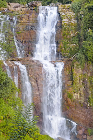 big waterfall in the mountainsの写真素材