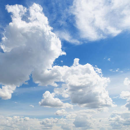 white clouds on a blue sky backgroundの写真素材