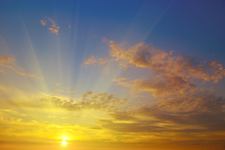 sunrise on the background of cloudy skyの写真素材