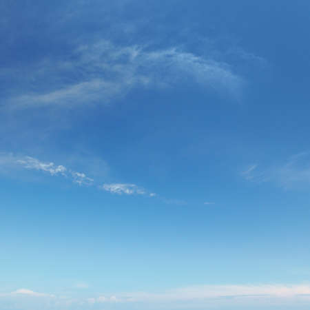 light clouds on a blue sky backgroundの写真素材