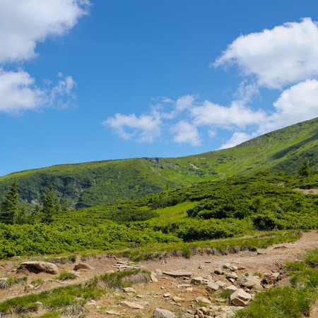 beautiful mountain slopes and blue skyの写真素材