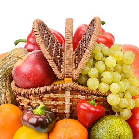 vegetables and fruits in a basket isolated on white backgroundの写真素材