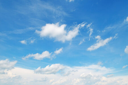 white clouds on a blue sky backgroundの写真素材