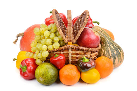 vegetables and fruits in a basket isolated on white backgroundの写真素材