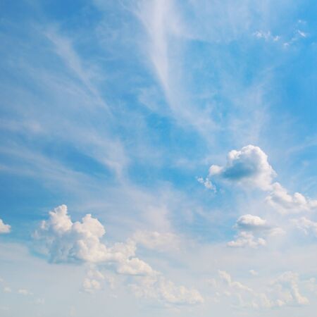 white clouds on a blue sky backgroundの写真素材