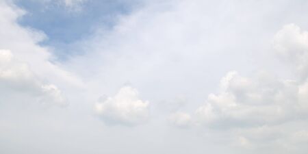 white clouds on a blue sky backgroundの写真素材