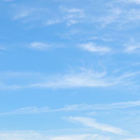 plumose clouds in the blue skyの写真素材