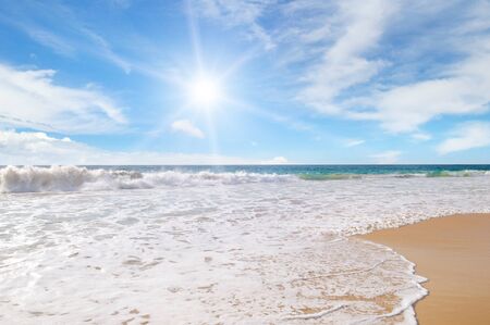 ocean, sandy beach and blue skyの写真素材