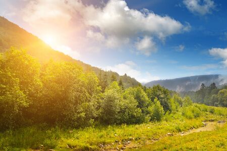 sunrise over the mountainsideの写真素材