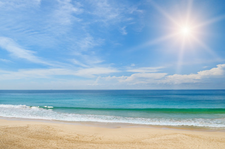 ocean, sandy beach and blue skyの写真素材