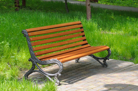 park bench and green lawnの写真素材