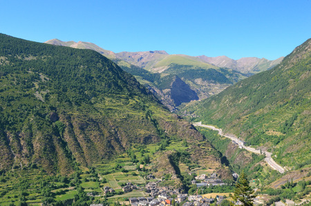 scenic mountains and the city in a mountain valleyの写真素材