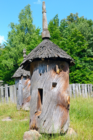 Ancient beehive hollowed from a tree trunkの写真素材