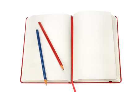 notepad and pencils isolated on white backgroundの写真素材