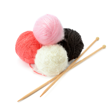 skeins of yarn and knitting needles isolated on a white backgroundの写真素材