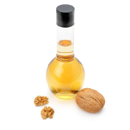 fruit and walnut oil isolated on a white backgroundの写真素材