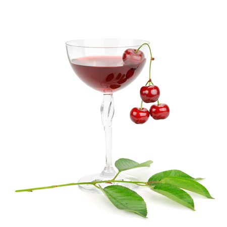 cherry and glass of juice isolated on white backgroundの写真素材