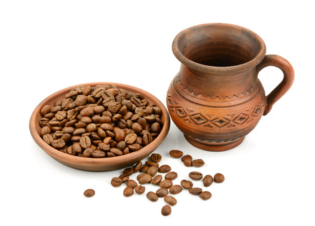 ceramic cup of coffee beans isolated on white backgroundの写真素材