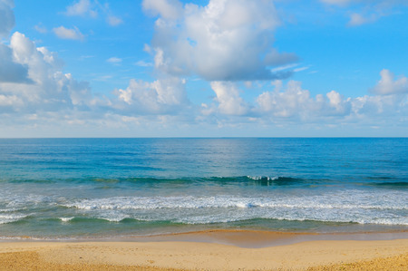 ocean, sandy beach and blue skyの写真素材
