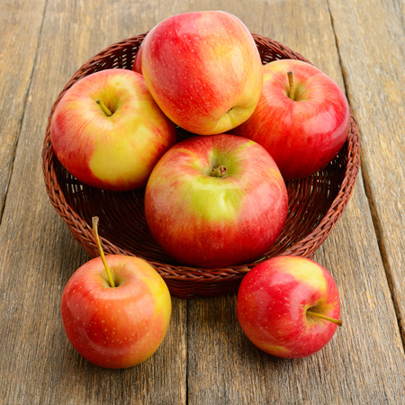 red apples on a wooden surfaceの写真素材