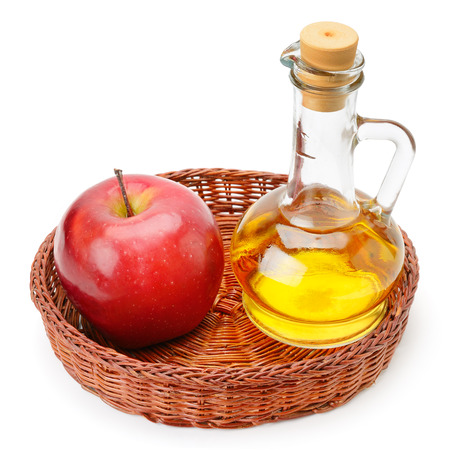 apple cider vinegar and apples isolated on white backgroundの写真素材