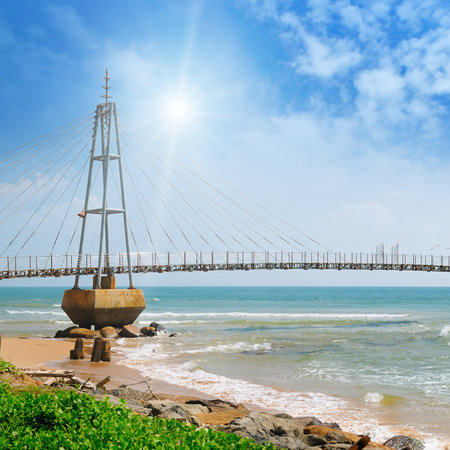 The bridge to the island, the ocean and the sun in the blue sky (Matara, Sri Lanka)のeditorial素材