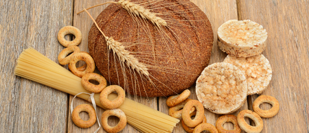 bread, pasta and pastries on a wooden surfaceの写真素材
