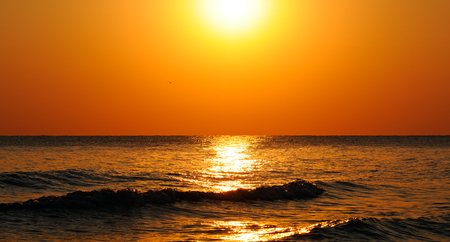 Fantastic sunrise on the oceanの写真素材