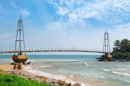 Bridge to the island with a Buddhist temple, Matara, Sri Lankaの写真素材