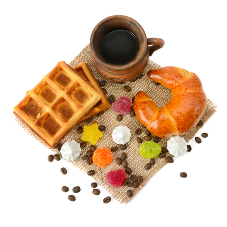 Cup of coffee, croissant, waffles and marmalade isolated on white background.の写真素材