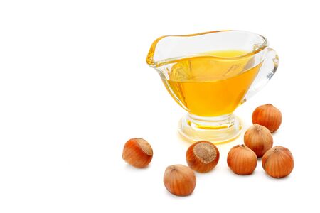 Oil and fruit hazelnut isolated on white background. Free space for text.の写真素材