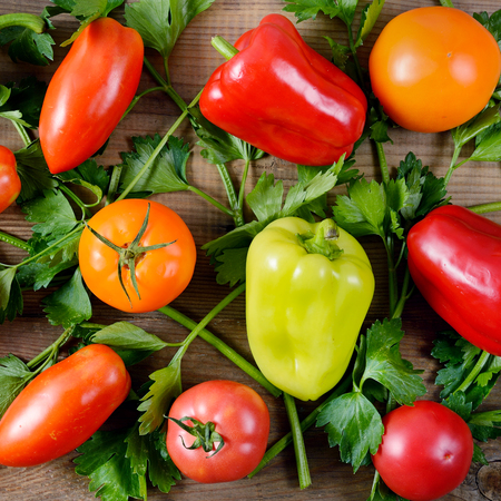Healthy food background. Vegetables on old wooden table. Flat lay, top view.の写真素材