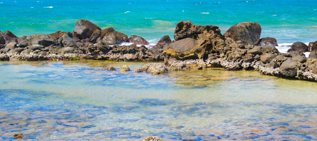 The lagoon is separated from the ocean by a coral reef.Tropical seascape. A bright sunny day. Wide photo.の写真素材