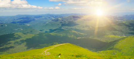 Sunrise in the mountains. View from the top of the mountain Hoverla, Carpathian Ukraine. Wide photo.の写真素材