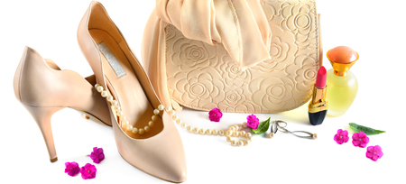 Ladies bag, shoes, jewelry, cosmetics and perfumes isolated on white background. Elegant set of accessory for women.Wide photo.の写真素材