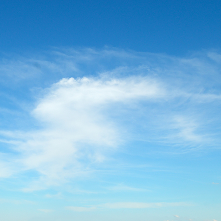 Light cirrus clouds against the blue sky.の写真素材
